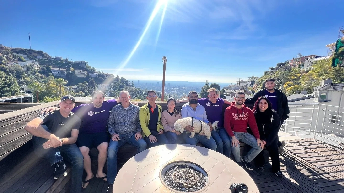 Hackathon participants gathered together on an outdoor terrace